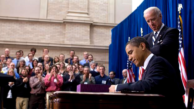 President Obama signs the American Recovery and Reinvestment Act as Vice President Biden watches in Denver, Colo. on Feb. 17, 2009. (White House photo by Pete Souza)