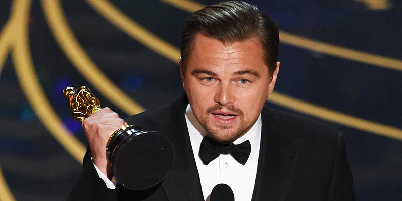 Actor Leonardo DiCaprio accepts the award for Best Actor in,The Revenant on stage at the 88th Oscars on February 28, 2016 in Hollywood, California. AFP PHOTO / MARK RALSTON / AFP / MARK RALSTON (Photo credit should read MARK RALSTON/AFP/Getty Images)